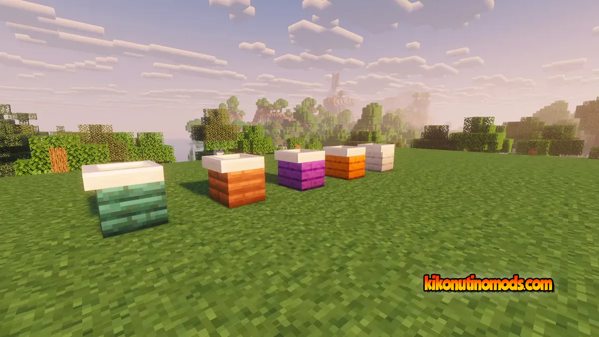 Varios fregaderos de cocina de colores diferentes sobre césped, con shaders